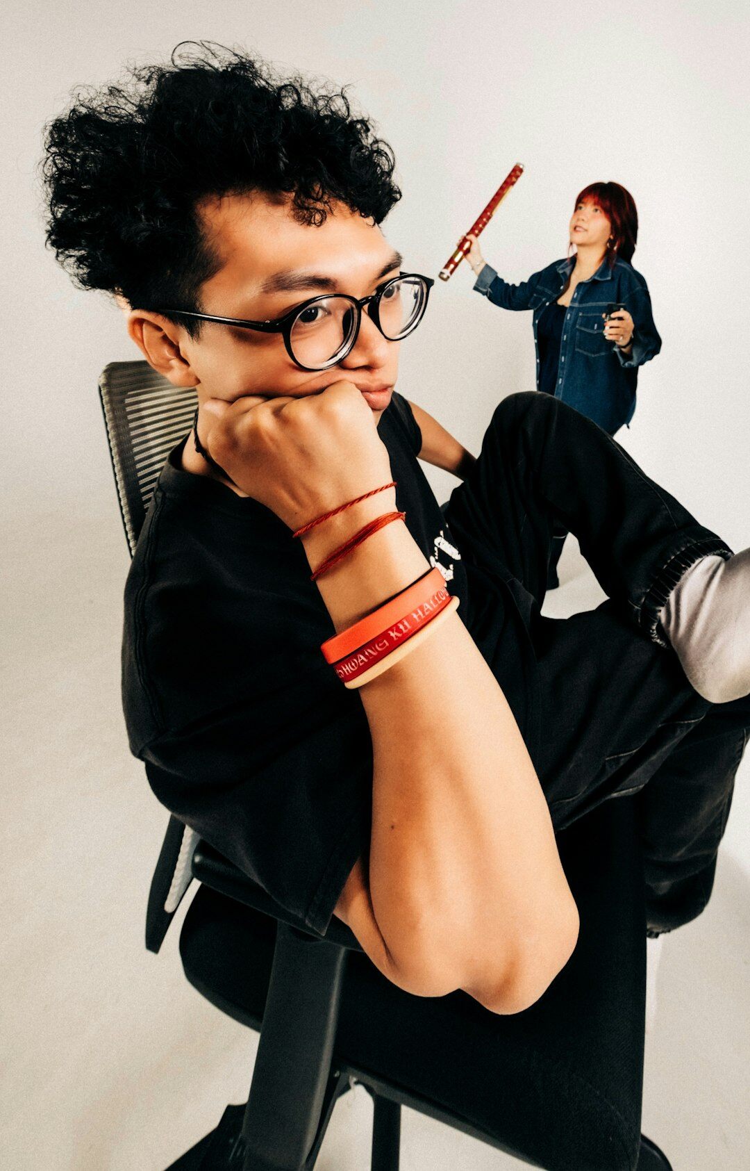 Portrait of a fashion designer with glasses in a creative studio