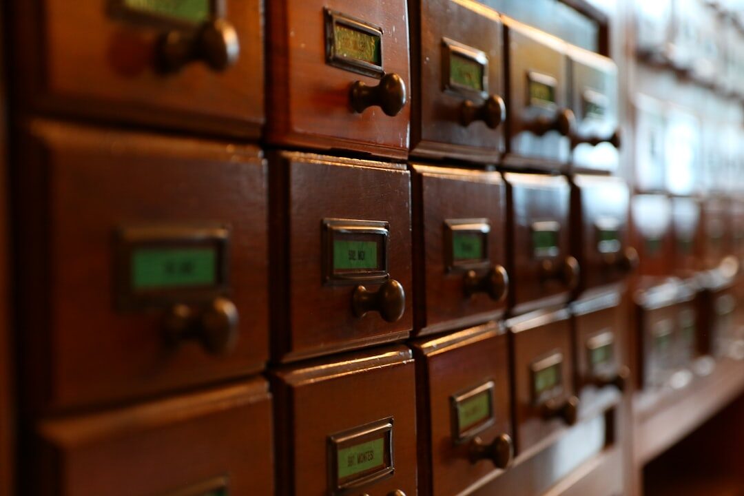 Rows of vintage film reels and negatives in an archive cabinet
